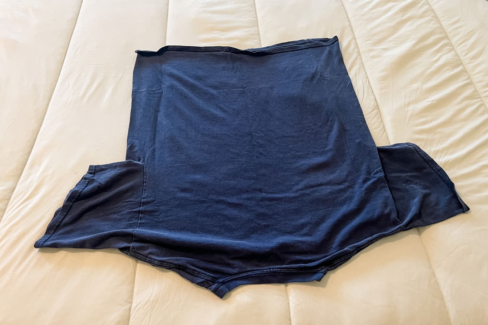 t-shirt on bed